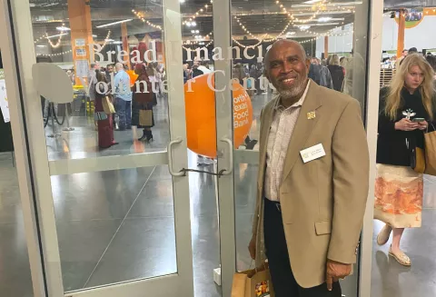 Calvin Hinton poses for a picture at the Bread Financial Volunteer Center at the North Texas Food Bank.