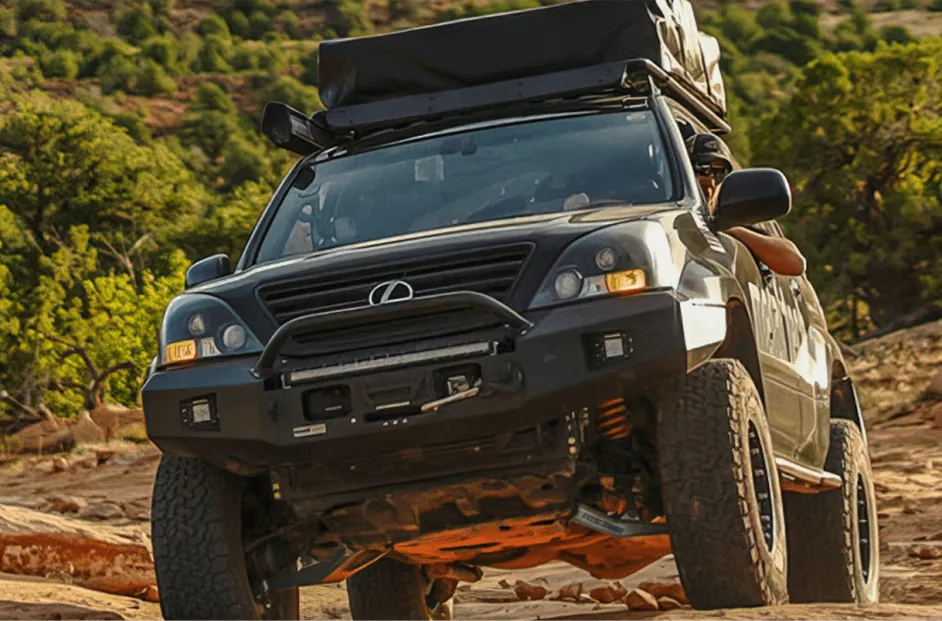 SUV driving on dirt/grass