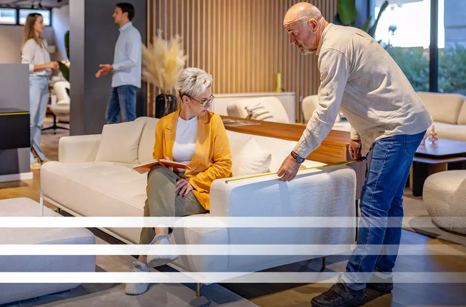 Older woman and man shop at a boutique furniture store.