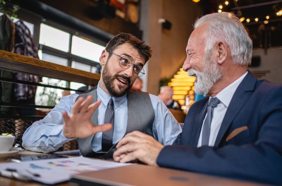 Modern business people taking a coffee break for a small talk in the modern coffee shop
