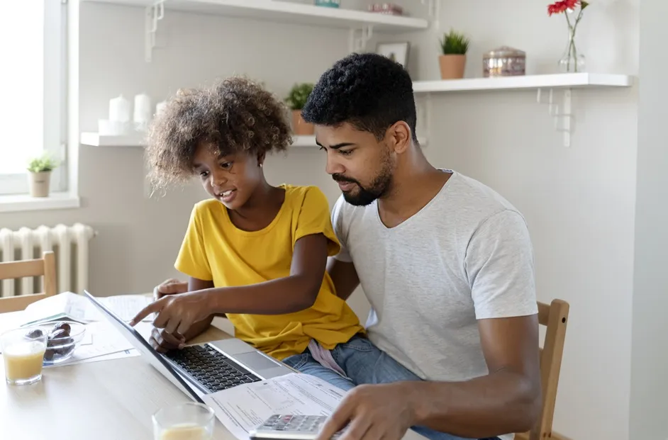 Fathering teaching his daughter about invisible money