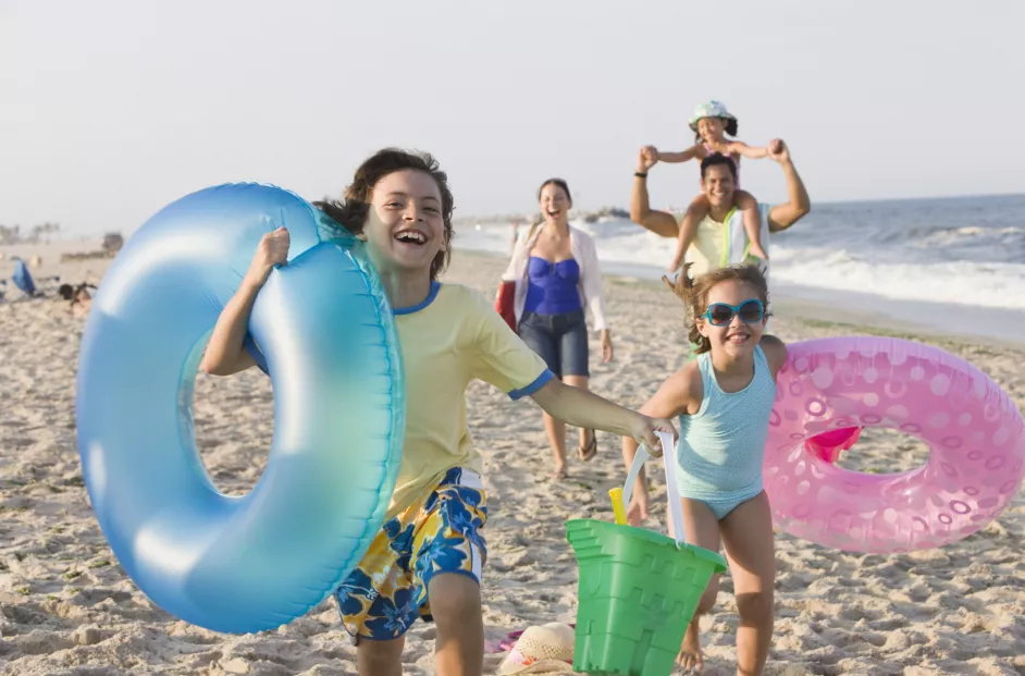 Family of five enjoying a beach vacation