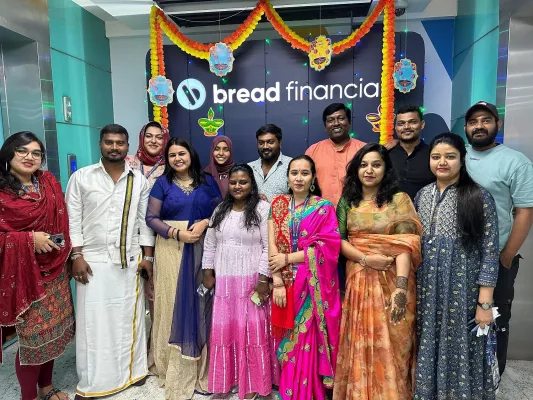 Group picture of Bread Financial associates in India. Associates are wearing festive clothing in celebration of Diwali.