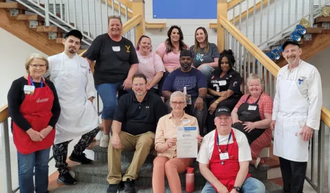 A group of Bread Financial associates gather for a picture at Ronald McDonald House