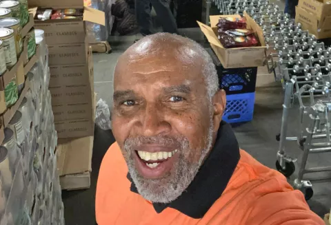 Calvin Hinton takes a selfie while volunteering for the North Texas Food Bank.