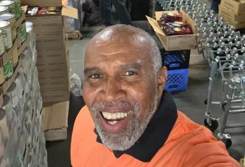 Calvin Hinton Volunteering with the NTFB. Calvin Hinton takes a selfie while volunteering for the North Texas Food Bank.