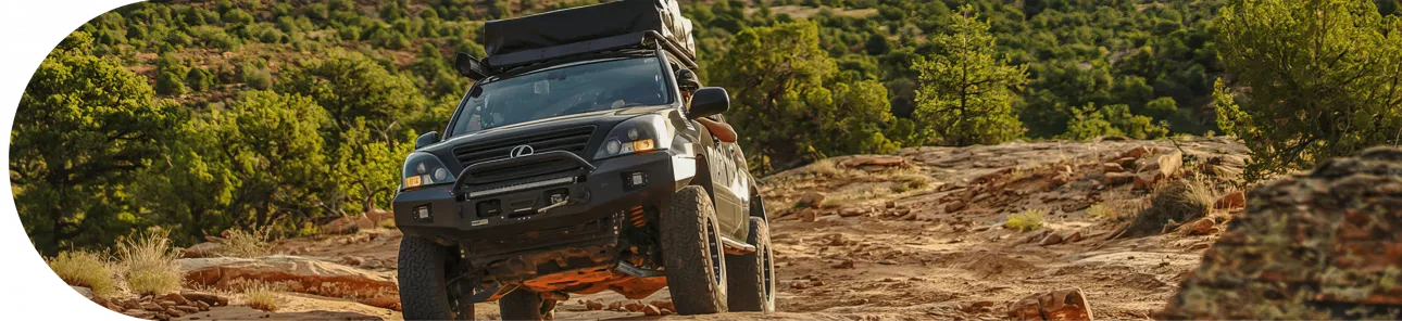 SUV driving on dirt/grass