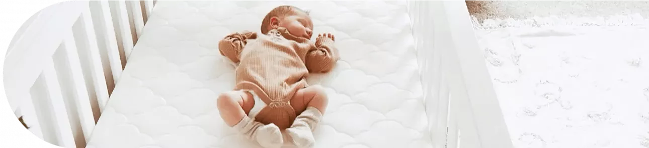 Baby sleeping in a crib