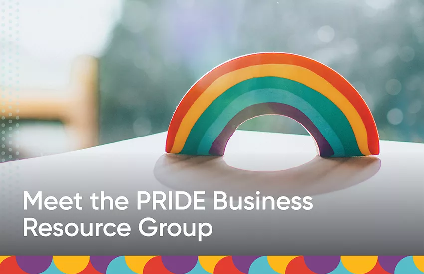 Rainbow on a table top with the accompanying text: "Meet the PRIDE Business Resource Group"