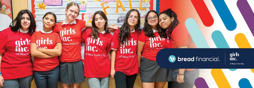 Group of girls pose outside of a classroom in red Girls Inc. t-shirts. Bread Financial and Girls, Inc. of New York City logos are included in the lower right corner of the image, along with Bauhaus design elements.