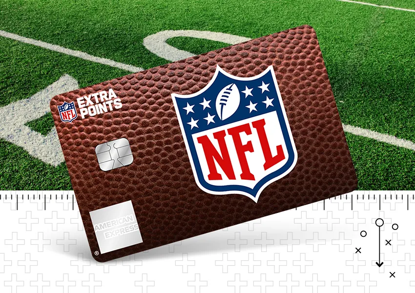 American Express NFL Extra Points credit card with a football-textured design displayed at an angle on a green football field. The card features the NFL shield logo prominently in the center, the NFL Extra Points logo in the upper left corner, a payment chip on the left side, and American Express branding in the lower left corner. A football field yard line and a ruler-style graphic border are visible in the background.