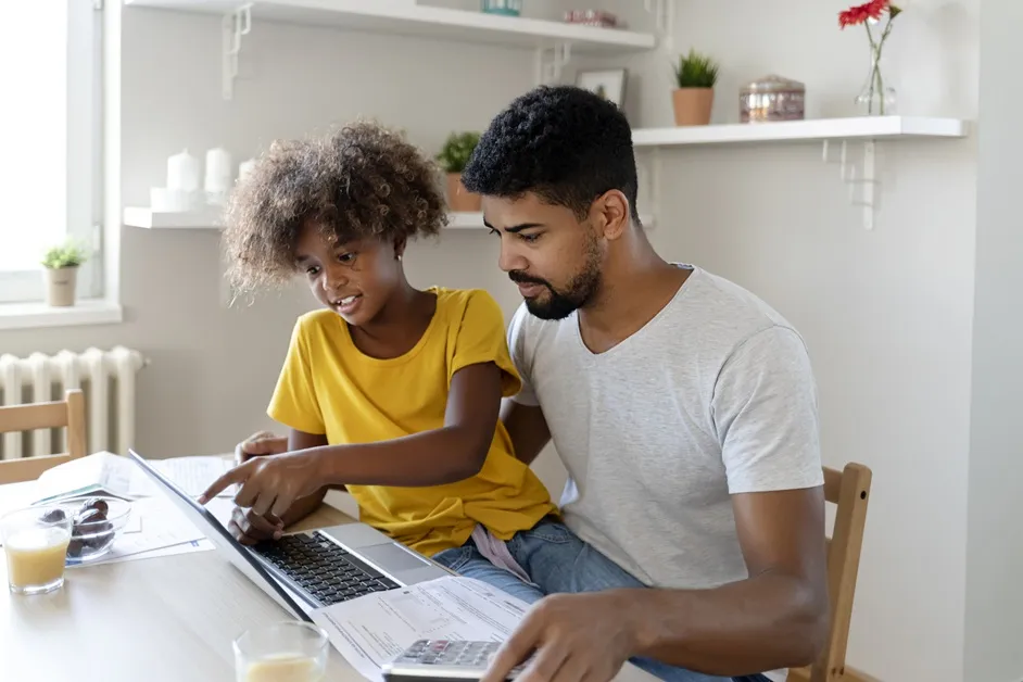Fathering teaching his daughter about invisible money