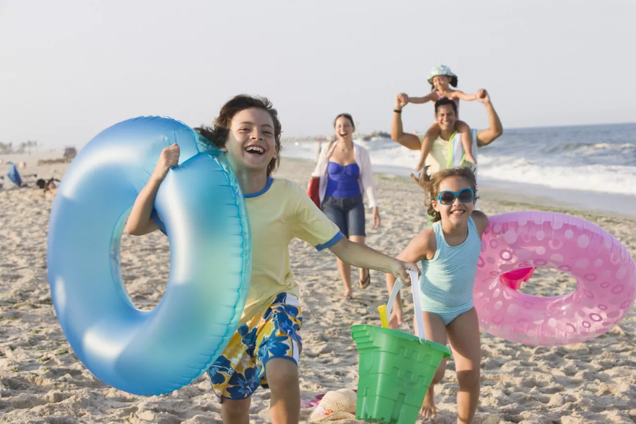 Family of five enjoying a beach vacation