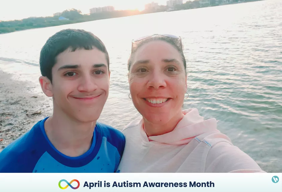 Tez Reardon, senior manager of DE&I at Bread Financial, takes a selfie on the beach with her son, Tyson.