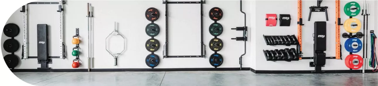 Wall with a variety of weights and workout equipment